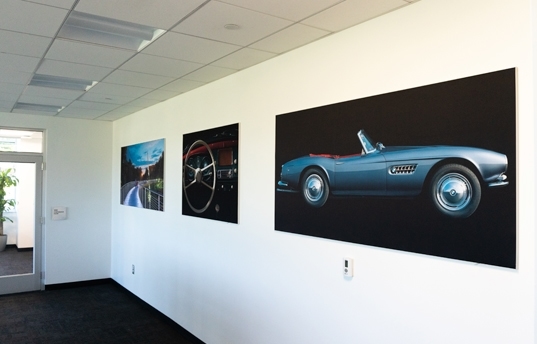 three large signs on BMW office wall