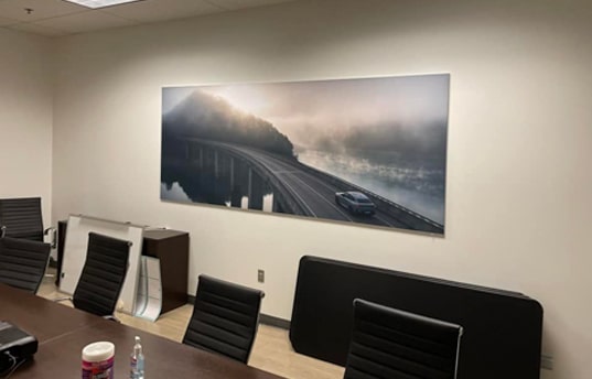 seg frames hanging in BMW conference room